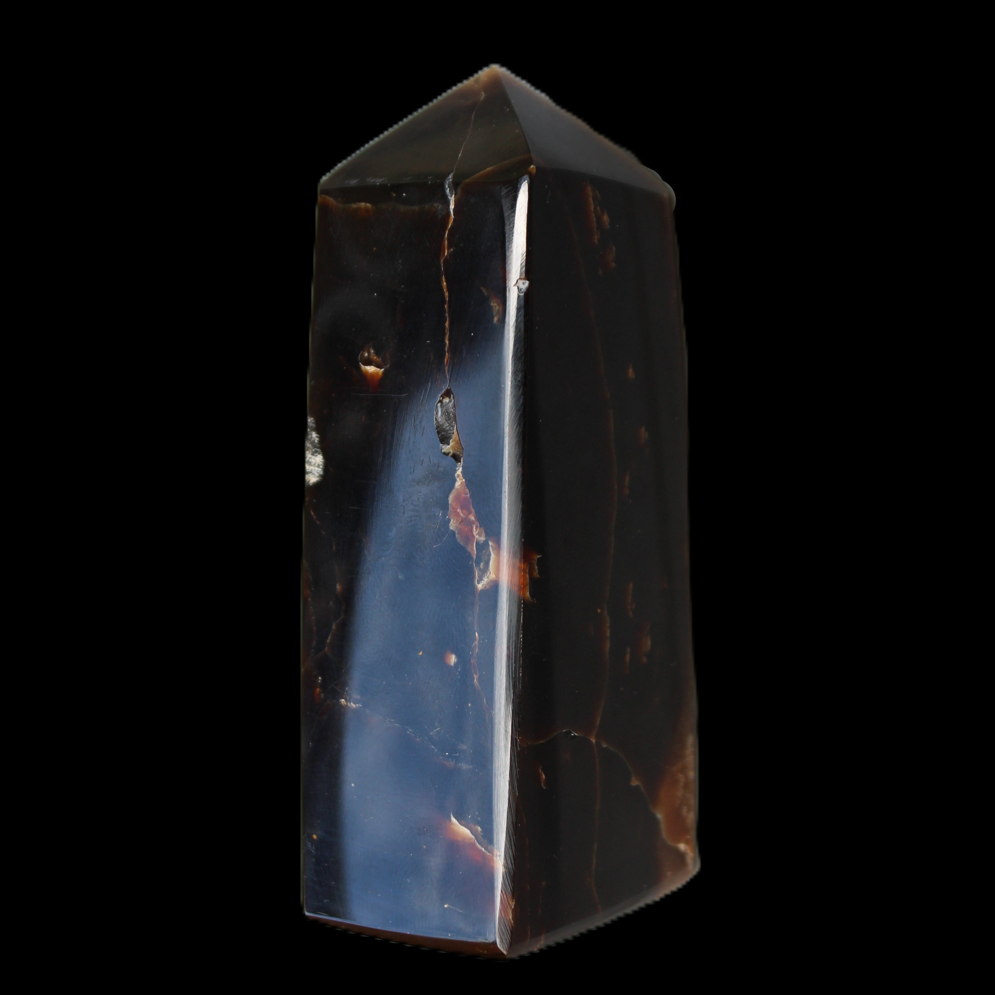 Chocolate Calcite obelisk 100*40mm 286g in sunlight - Rocks and Things Store