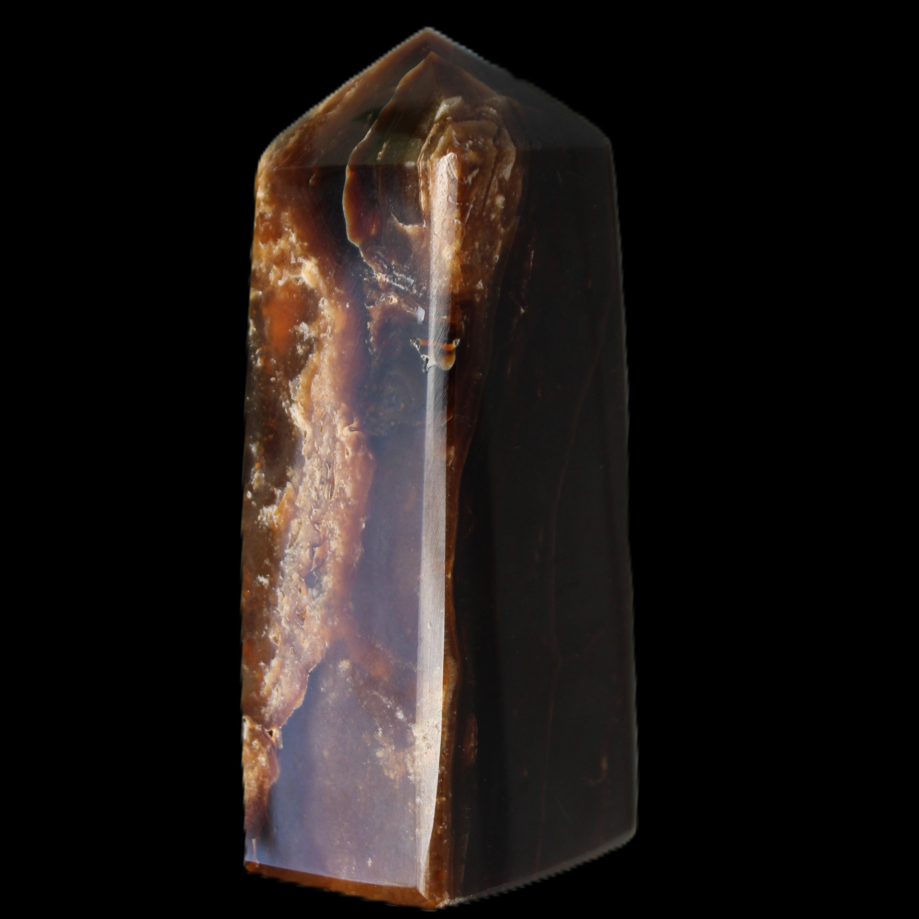 Chocolate Calcite obelisk 100*40mm 286g in sunlight - Rocks and Things Store
