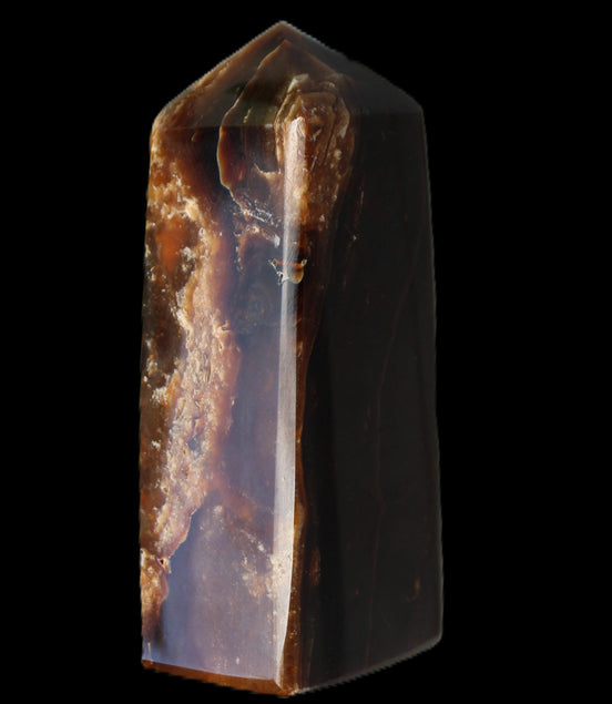 Chocolate Calcite obelisk 100*40mm 286g in sunlight - Rocks and Things Store