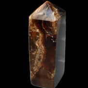 Chocolate Calcite obelisk 100*40mm 286g in sunlight - Rocks and Things Store