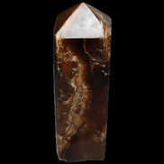 Chocolate Calcite obelisk 100*40mm 286g in sunlight - Rocks and Things Store