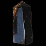 Chocolate Calcite obelisk 100*40mm 286g in sunlight - Rocks and Things Store