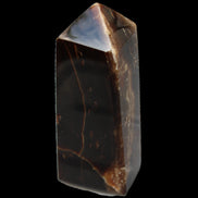Chocolate Calcite obelisk 100*40mm 286g in sunlight - Rocks and Things Store
