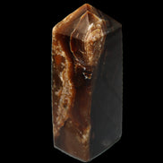 Chocolate Calcite obelisk 100*40mm 286g in sunlight - Rocks and Things Store