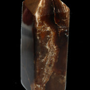 Chocolate Calcite obelisk 100*40mm 286g in sunlight - Rocks and Things Store