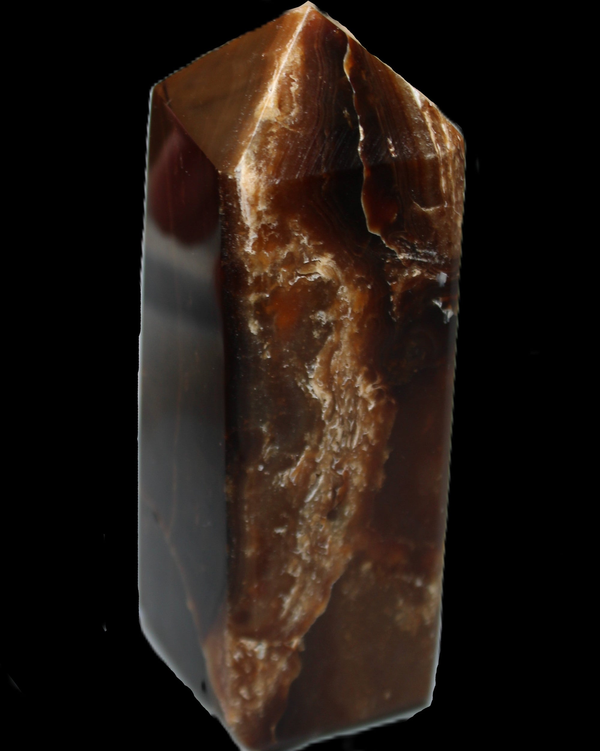 Chocolate Calcite obelisk 100*40mm 286g in sunlight - Rocks and Things Store