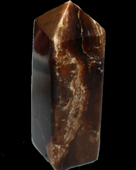 Chocolate Calcite obelisk 100*40mm 286g in sunlight - Rocks and Things Store