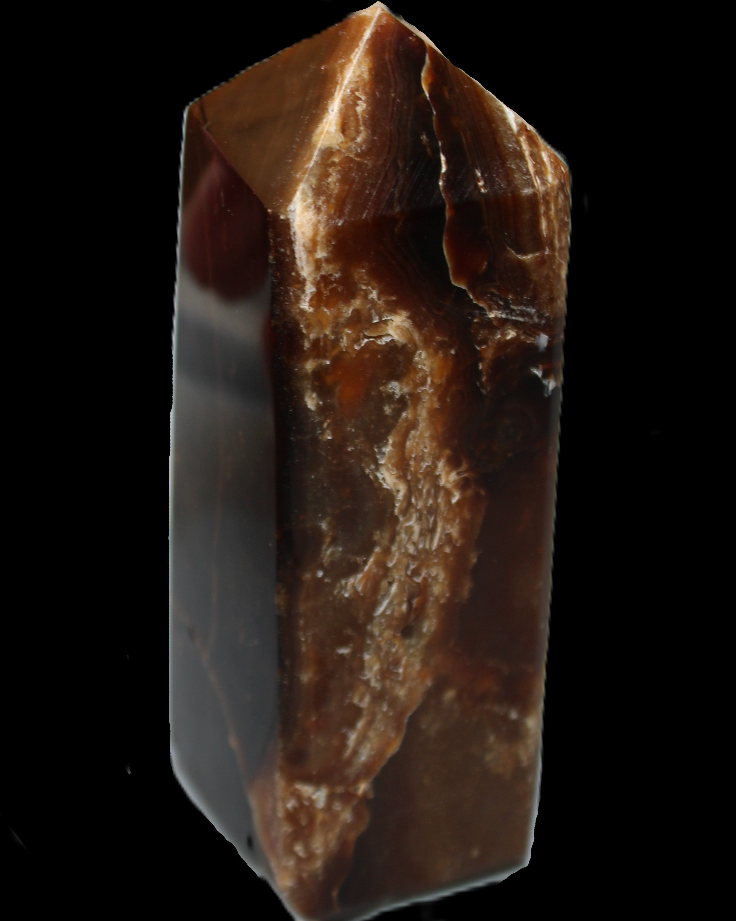Chocolate Calcite obelisk 100*40mm 286g in sunlight - Rocks and Things Store