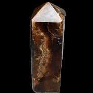 Chocolate Calcite obelisk 100*40mm 286g in sunlight - Rocks and Things Store