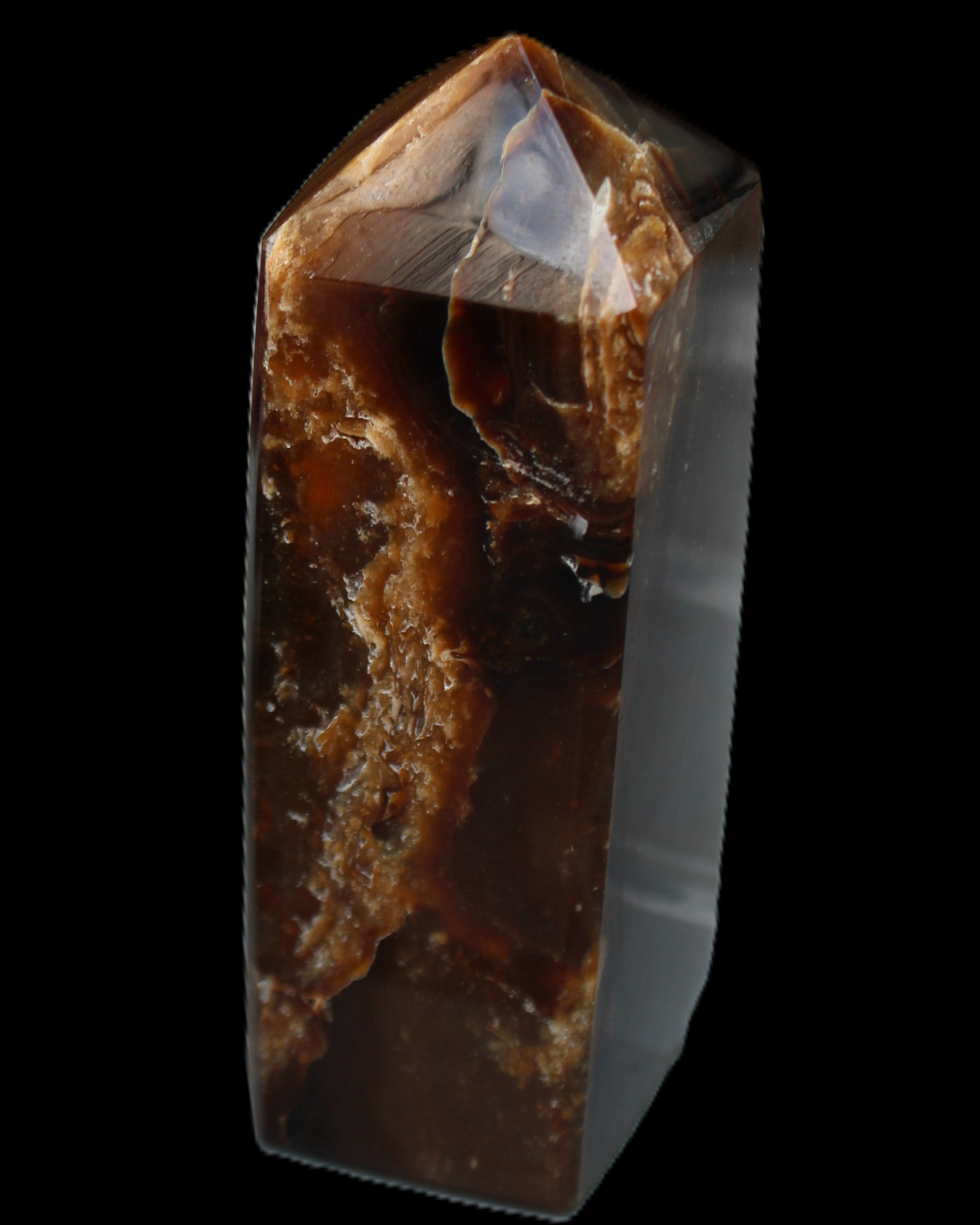 Chocolate Calcite obelisk 100*40mm 286g in sunlight - Rocks and Things Store