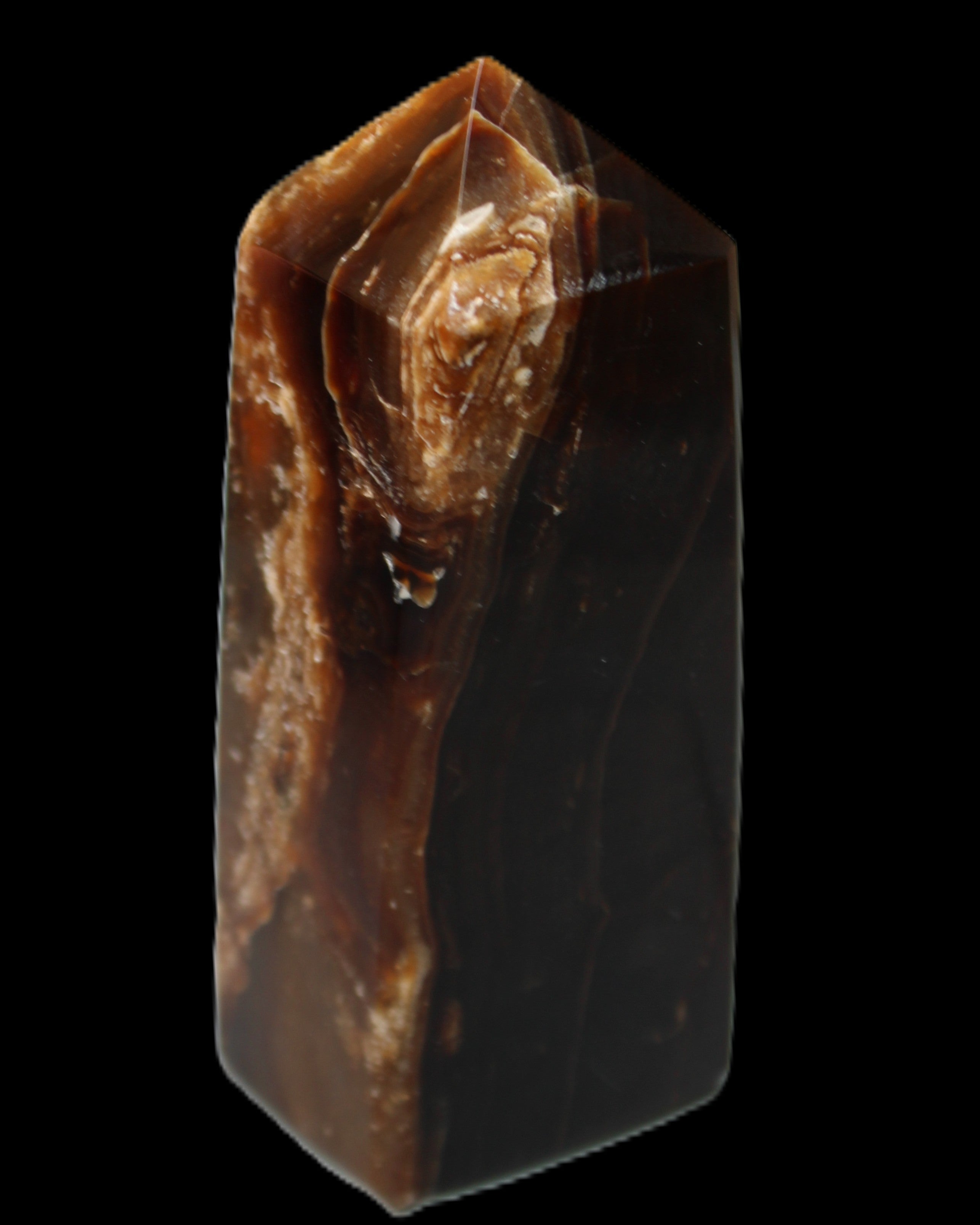 Chocolate Calcite obelisk 100*40mm 286g in sunlight - Rocks and Things Store