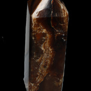 Chocolate Calcite obelisk 100*40mm 286g in sunlight - Rocks and Things Store