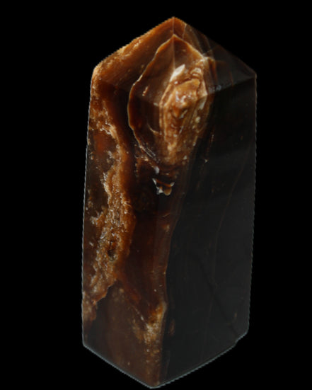 Chocolate Calcite obelisk 100*40mm 286g in sunlight - Rocks and Things Store