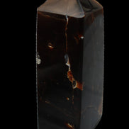 Chocolate Calcite obelisk 100*40mm 286g in sunlight - Rocks and Things Store