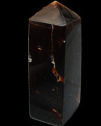 Chocolate Calcite obelisk 100*40mm 286g in sunlight - Rocks and Things Store