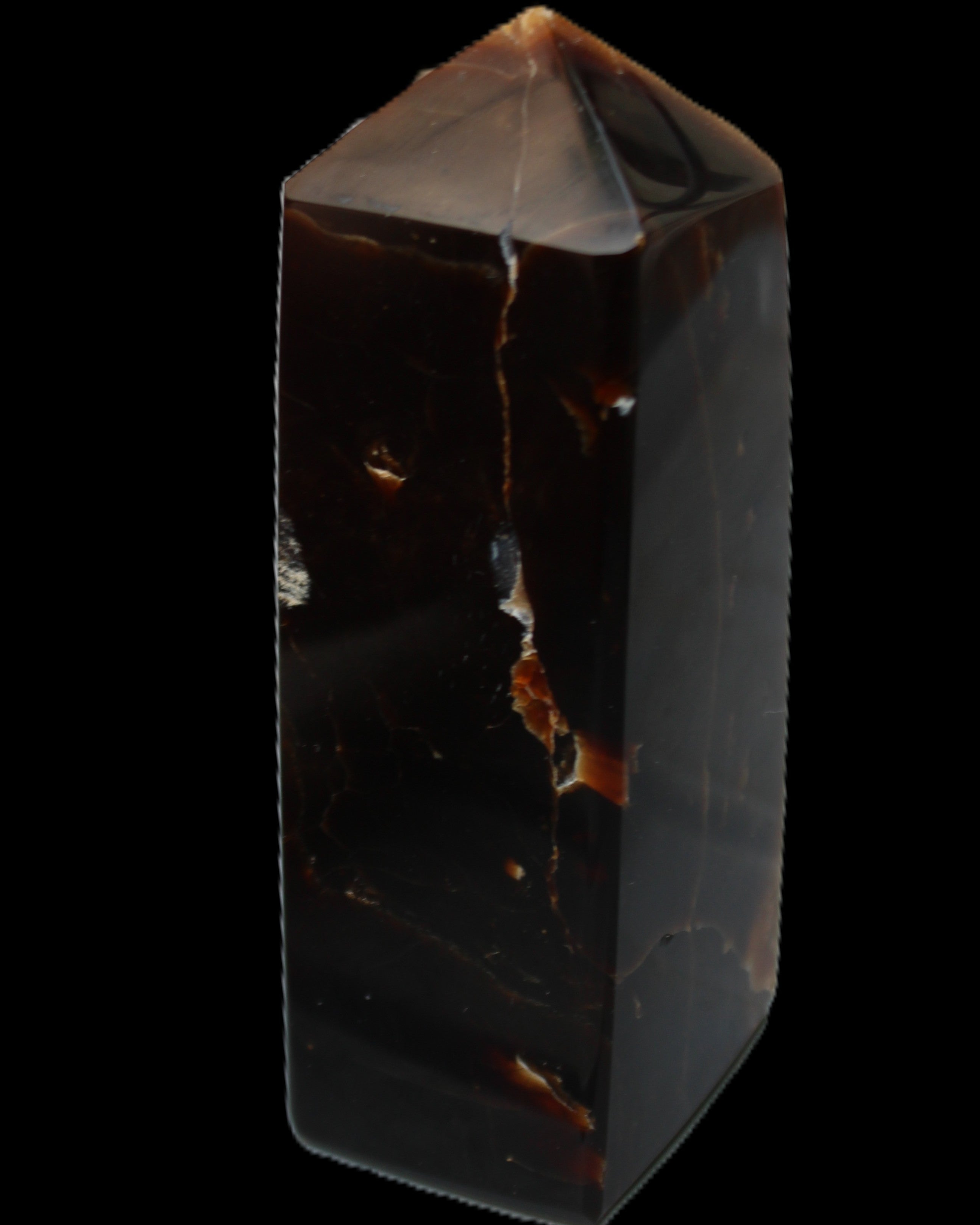 Chocolate Calcite obelisk 100*40mm 286g in sunlight - Rocks and Things Store