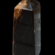 Chocolate Calcite obelisk 100*40mm 286g in sunlight - Rocks and Things Store