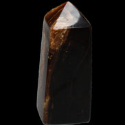 Chocolate Calcite obelisk 100*40mm 286g in sunlight - Rocks and Things Store