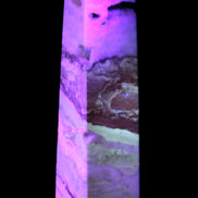 Caribbean aqua blue Calcite obelisk 479g in UV light - Rocks and Things Store