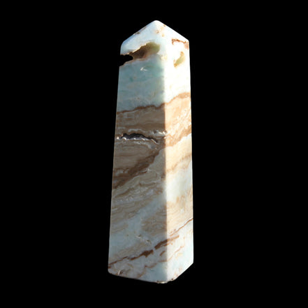 Caribbean aqua blue Calcite obelisk 479g in sunlight - Rocks and Things Store