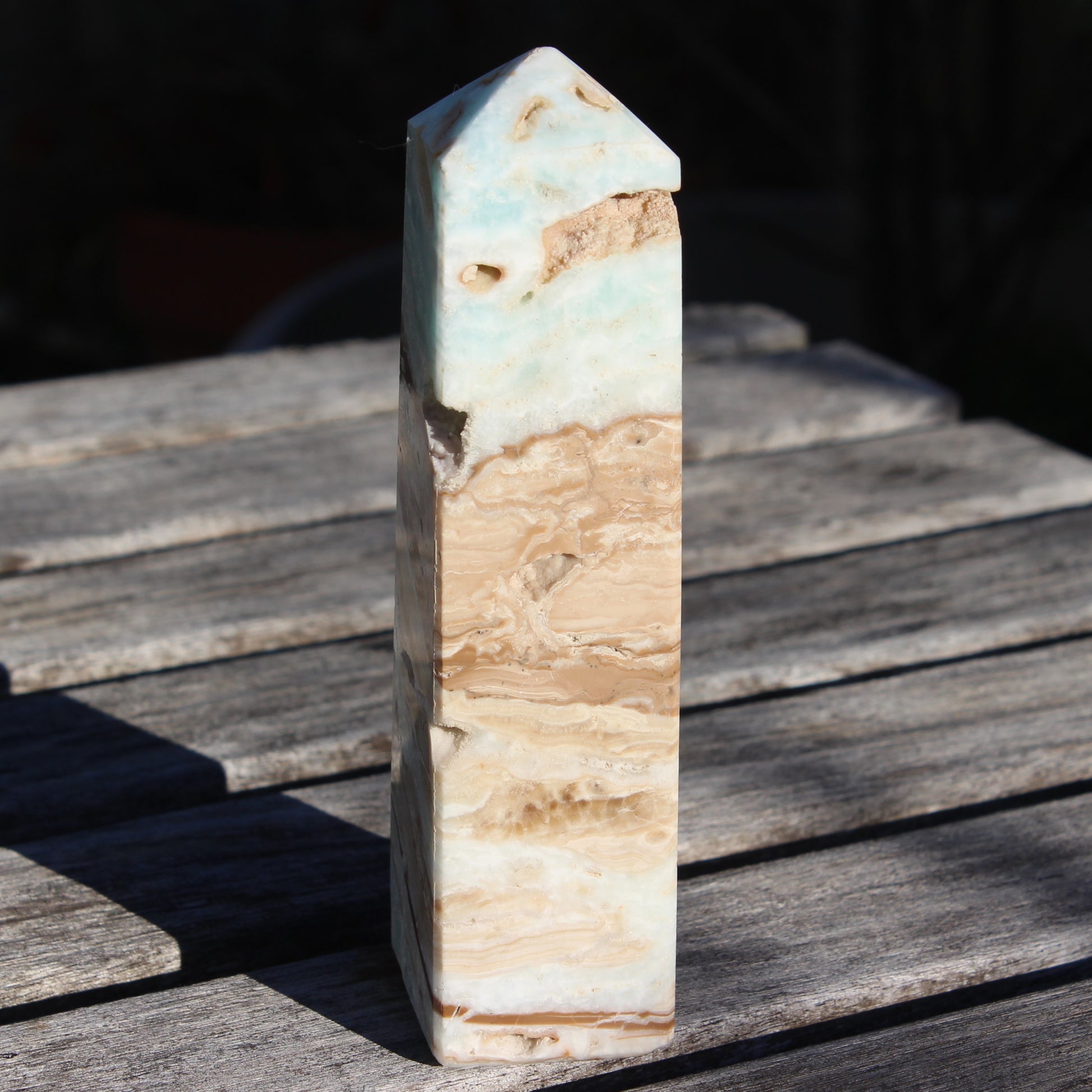 Caribbean aqua blue Calcite obelisk 479g in sunlight - Rocks and Things Store