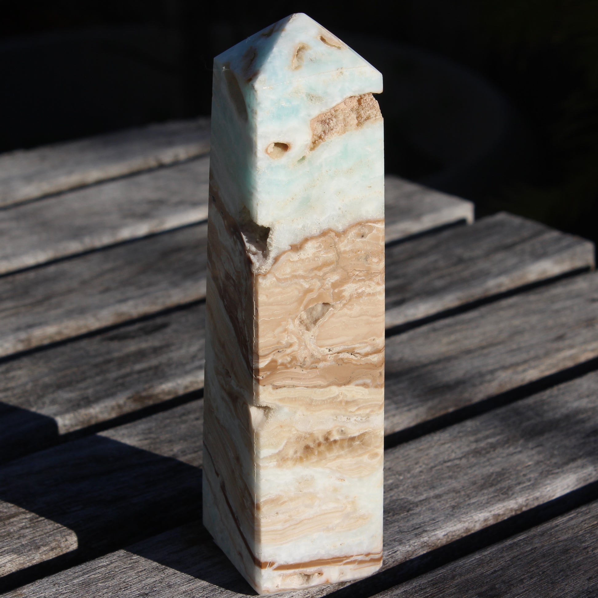 Caribbean aqua blue Calcite obelisk 479g in sunlight - Rocks and Things Store