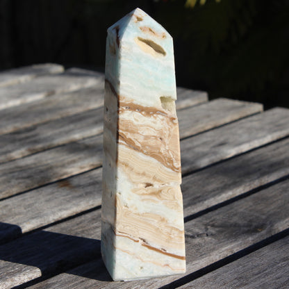 Caribbean aqua blue Calcite obelisk 479g in sunlight - Rocks and Things Store