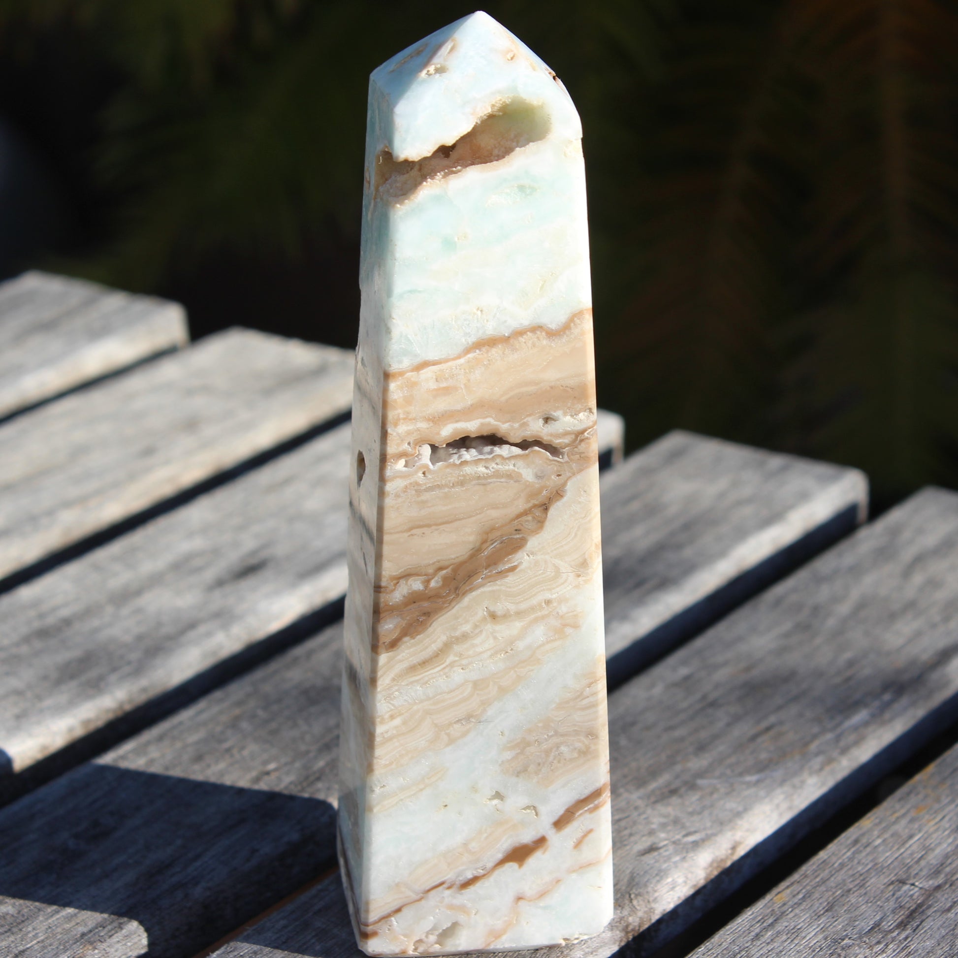 Caribbean aqua blue Calcite obelisk 479g in sunlight - Rocks and Things Store