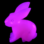 Mangano Calcite bunny 76*36*100mm 396g in UV light - Rocks and Things Store