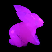 Mangano Calcite bunny 76*36*100mm 396g in UV light - Rocks and Things Store