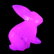 Mangano Calcite bunny 76*36*100mm 396g in UV light - Rocks and Things Store