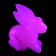 Mangano Calcite bunny 76*36*100mm 396g in UV light - Rocks and Things Store