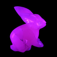 Mangano Calcite bunny 76*36*100mm 396g in UV light - Rocks and Things Store