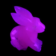 Mangano Calcite bunny 76*36*100mm 396g in UV light - Rocks and Things Store