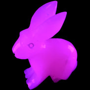 Mangano Calcite bunny 76*36*100mm 396g in UV light - Rocks and Things Store
