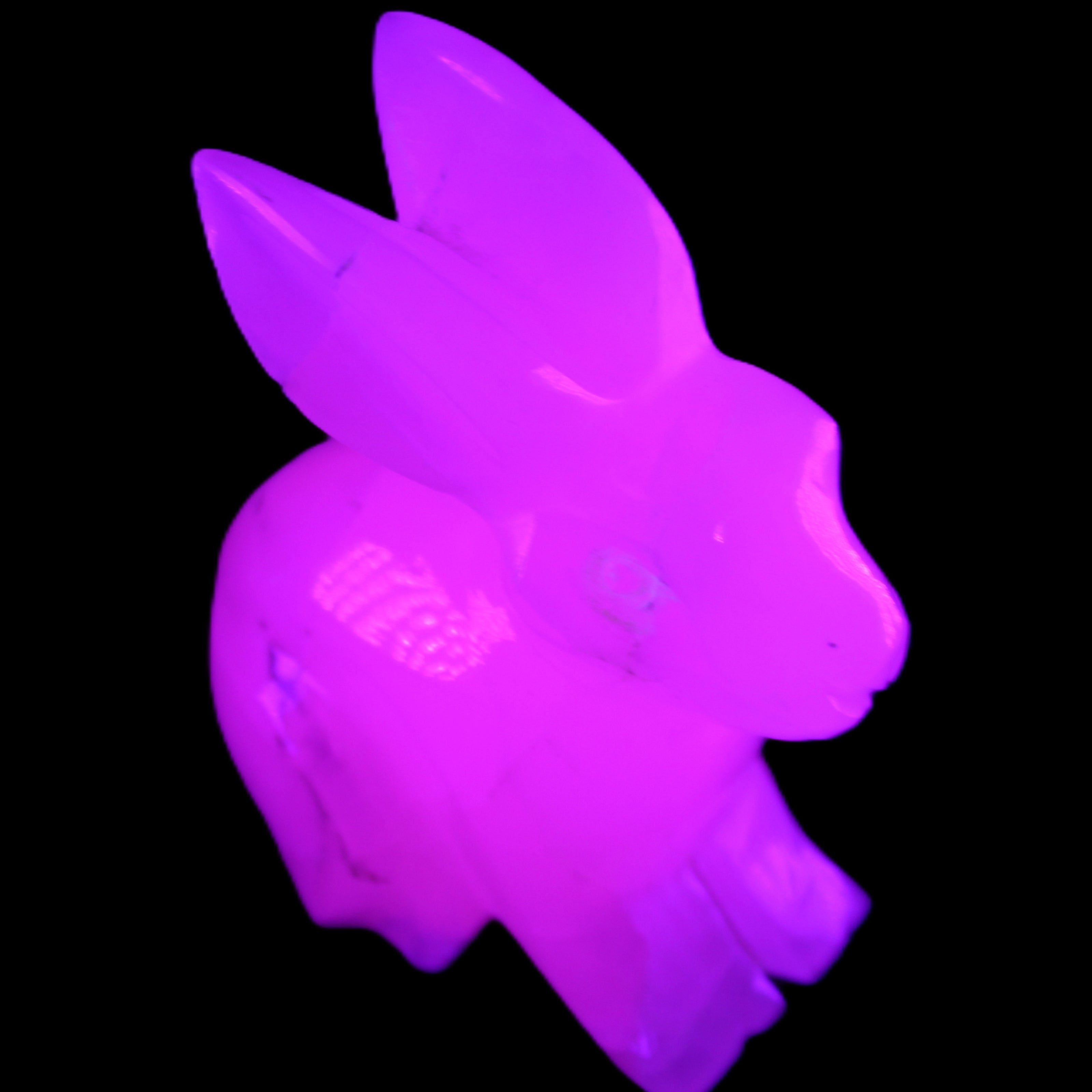 Mangano Calcite bunny 76*36*100mm 396g in UV light - Rocks and Things Store