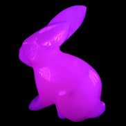Mangano Calcite bunny 76*36*100mm 396g in UV light - Rocks and Things Store