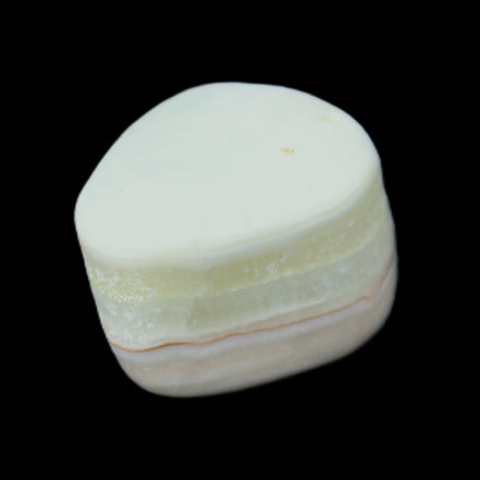 Pistachio Calcite tumbled stone 25-40mm 20-31g in sunlight - Rocks and Things Store