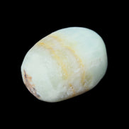 Pistachio Calcite tumbled stone 25-40mm 20-31g in sunlight - Rocks and Things Store