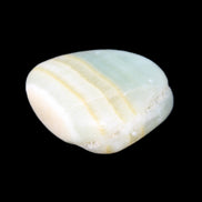 Pistachio Calcite tumbled stone 25-40mm 20-31g in sunlight - Rocks and Things Store