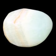 Pistachio Calcite tumbled stone 25-40mm 20-31g in sunlight - Rocks and Things Store