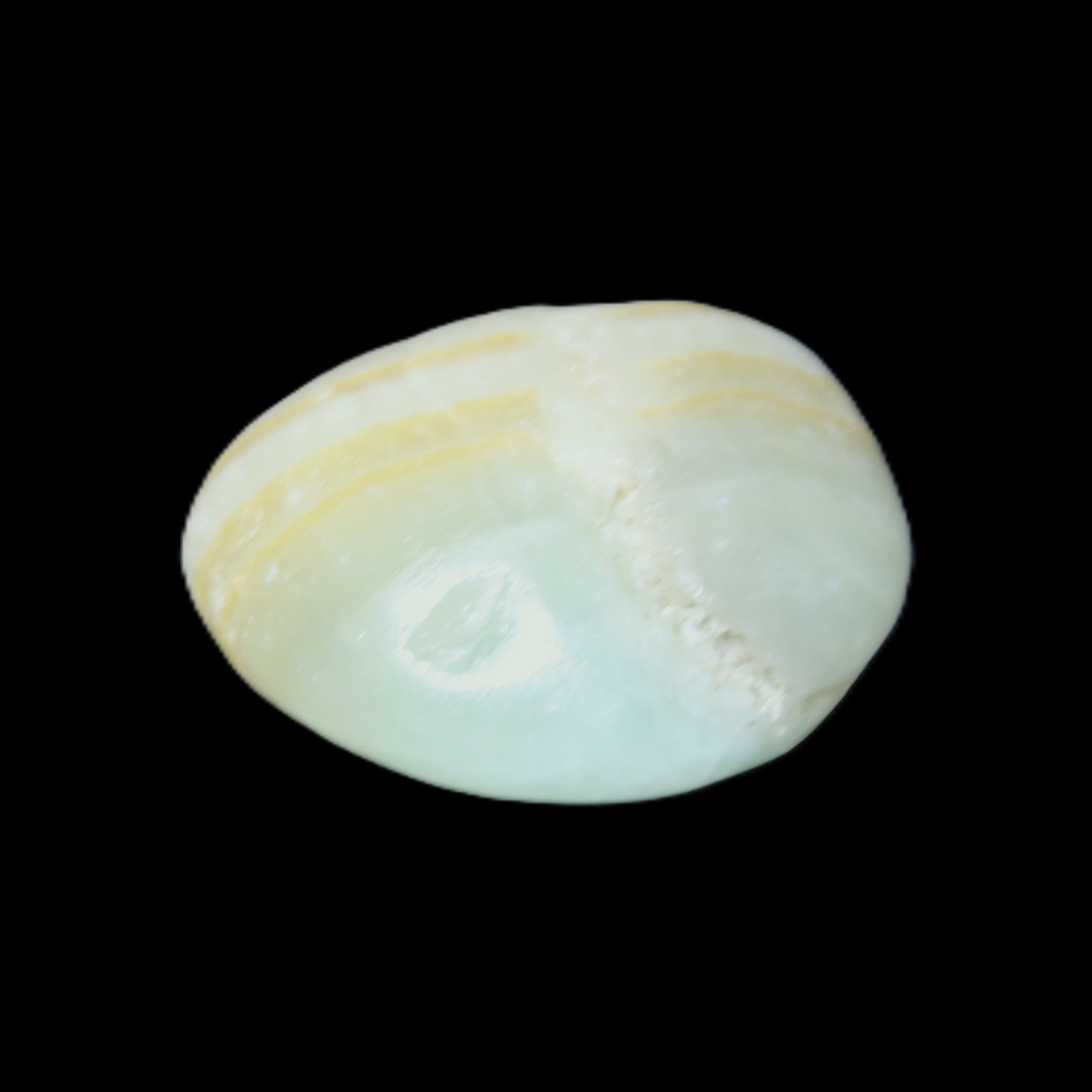 Pistachio Calcite tumbled stone 25-40mm 20-31g in sunlight - Rocks and Things Store