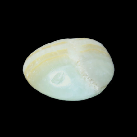 Pistachio Calcite tumbled stone 25-40mm 20-31g in sunlight - Rocks and Things Store