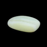 Pistachio Calcite tumbled stone 25-40mm 20-31g in sunlight - Rocks and Things Store