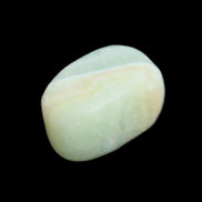 Pistachio Calcite tumbled stone 25-40mm 20-31g in sunlight - Rocks and Things Store