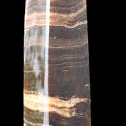 Chocolate Calcite obelisk 120*40*30mm 359g in sunlight - Rocks and Things Store