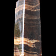 Chocolate Calcite obelisk 120*40*30mm 359g in sunlight - Rocks and Things Store