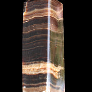 Chocolate Calcite obelisk 120*40*30mm 359g in sunlight - Rocks and Things Store