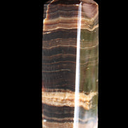 Chocolate Calcite obelisk 120*40*30mm 359g in sunlight - Rocks and Things Store