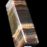 Chocolate Calcite obelisk 120*40*30mm 359g in sunlight - Rocks and Things Store